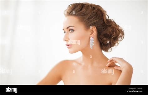 Woman Wearing Shiny Diamond Earrings Stock Photo Alamy