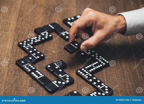 Businessman Playing With Dominoes Stock Photo Image Of Lines