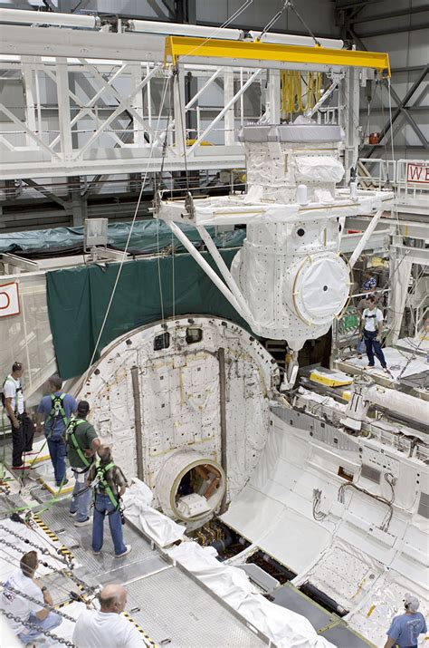 Space Shuttle Exhibit Homes Topple Trees Top Out Building Collectspace