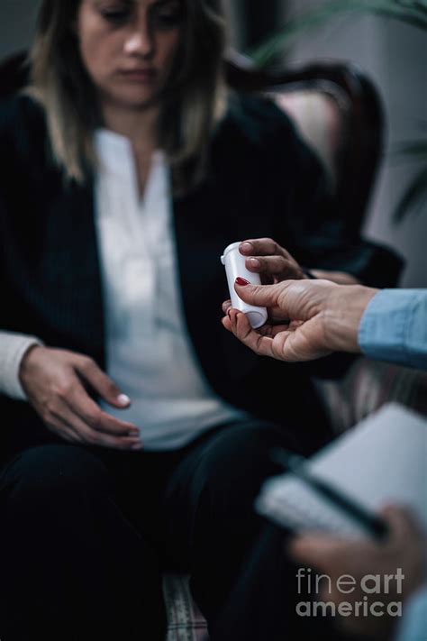 Psychotherapist Giving Medicine To A Woman Photograph By Microgen