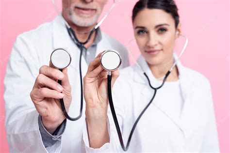 Premium Photo Doctors Is Holding And Showing Stethoscopes