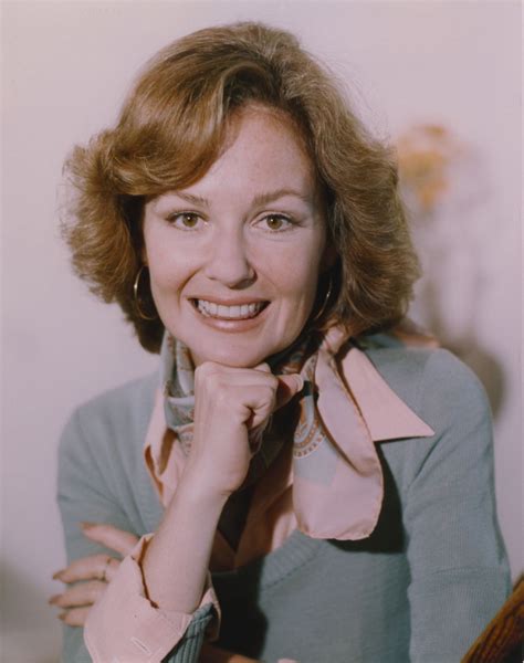 Shelley Fabares Wearing A Grey Tunic With A Scarf In A Close Up