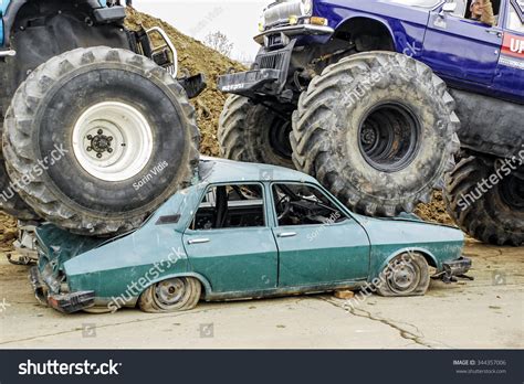 Cars Showbig Foot Vehicles Climbing Over And Crushing An Old Dacia Car
