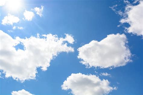 The Sun And Clouds On The Beautiful Blue Sky Partly Cloudy Stock Image