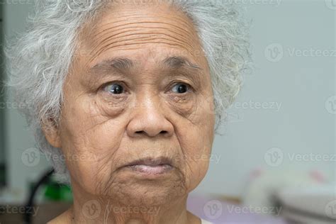 Asian Elderly Old Woman Face And Eye With Wrinkles Portrait Closeup