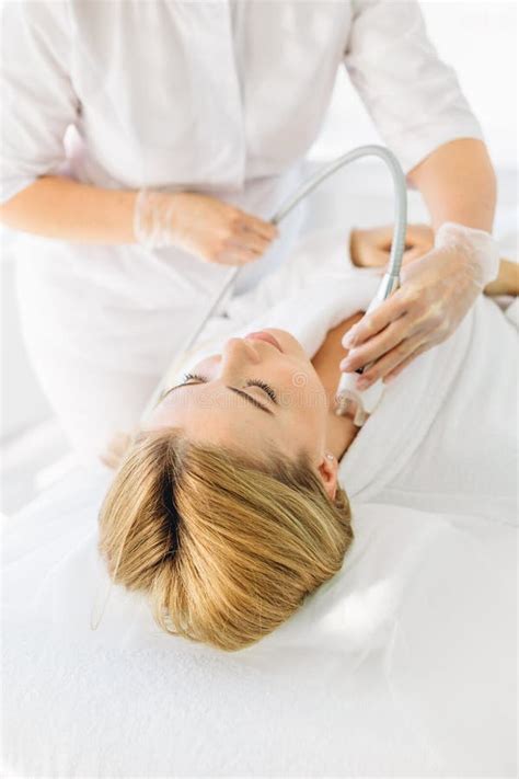 Woman Having A Stimulating Facial Treatment From A Therapist Stock Image Image Of Doctor