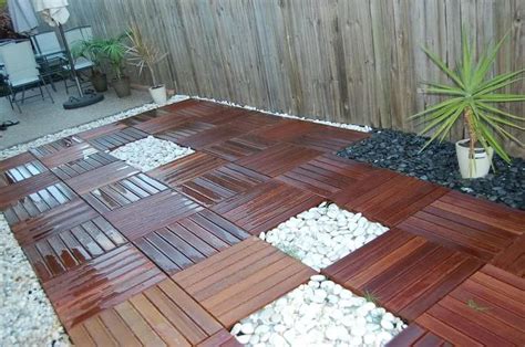 Boy are we so happy we did it! How To Create A Beautiful Wood Tile Patio Deck On A Budget - Do-It-Yourself Fun Ideas