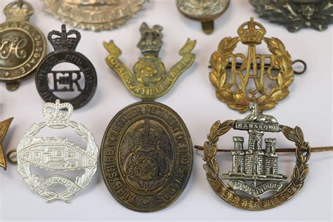 A Collection Of 15 British Military Cap Badges To Include The Loyal