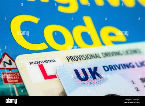 Uk Driving Licence Provisional And Full Licence Cards Placed On