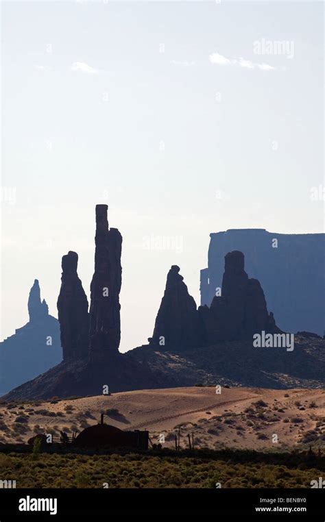 The Rock Formation Totem Pole With Navajo Settlement Monument Valley