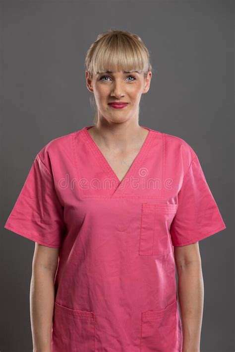 Portrait Of Young Attractive Female Nurse Posing Camera Looking Stock
