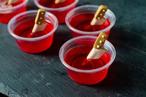 Strawberry Jello Shots With Candy Knives For Michael Myers Halloween