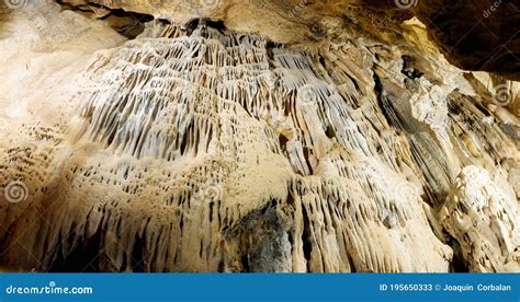 Stalactite And Stalagmite Formations On The Rocky Walls Of A Large