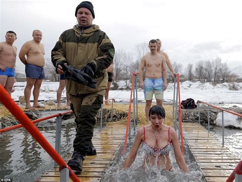 Russian Orthodox Christians Take Dips In Icy Water For Epiphany