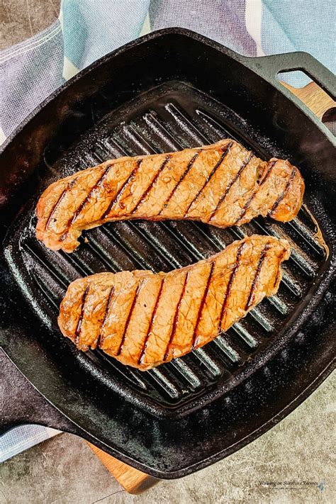 I wipe the pan with a light coat of oil when it is clean, and preheat it. Cast Iron Steak with Easy Marinade | Walking On Sunshine Recipes