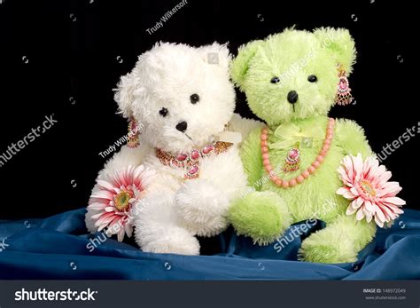 Two Stuffed Animals Decked Out In Jewelry And Flowers Concept Bff
