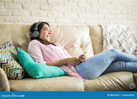 Enjoying Music In The Couch Stock Image Image Of Living Hispanic