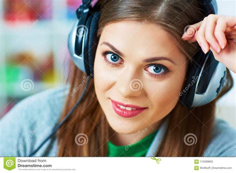 Close Up Portrait Of Young Woman Listening Music With Headphone Stock