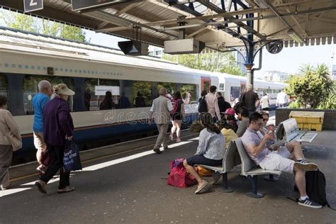 Passenger Train And Passengers On The Train Station Platform Editorial