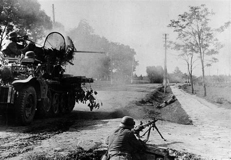 German Machine Gunner And A Sdkfz 105 Self Propelled Flak During The