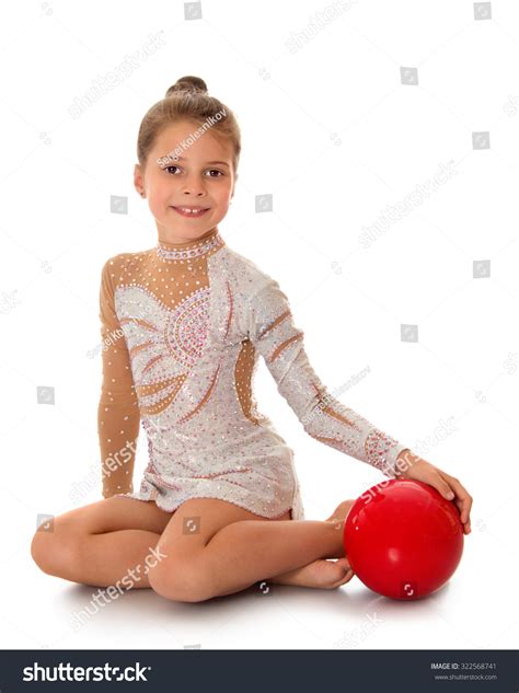 Beautiful Girl Gymnast Sitting On Floor Stock Photo 322568741