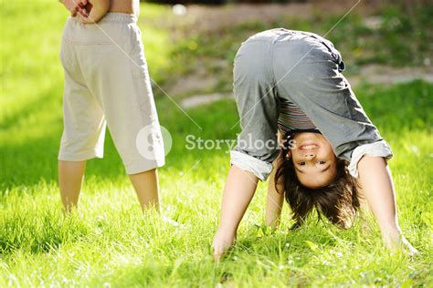 Group Of Happy Children Playing Outdoors In Spring Park Royalty Free
