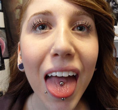 labret and vertical tongue piercing