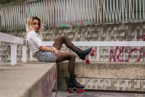 Profile Portrait Girl Wearing A Skirt And Black And Red Roller Skates