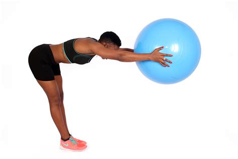 Fit Female Exercising With Yoga Swiss Ball