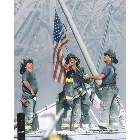 New York Firefighters Raising Flag At Ground Zero 911