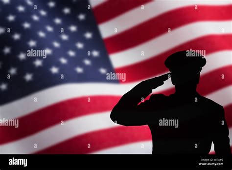 Silhouette Of Soldier Saluting In Front Of Us Flag Stock Photo Alamy
