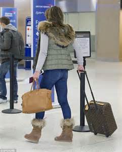Liz Hurley Wears Fur Trimmed Gilet And Boots As She Arrives At Jfk