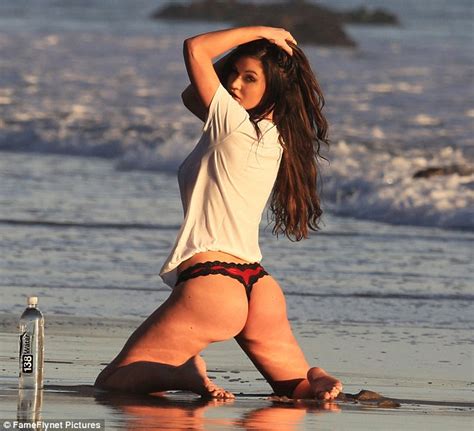 Busty Ashley Youdan Models Skimpy Bikinis In Photoshoot