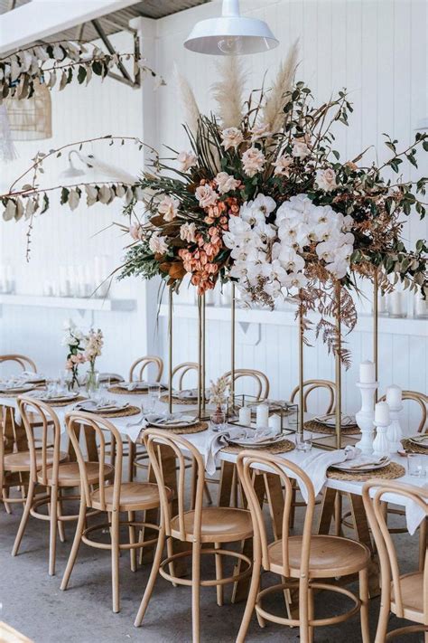 Take your wedding flowers and blend them with lush greenery and herbs for a texture, add cascading details if you a chic wedding centerpiece of eucalyptus and blush roses on a refind gold stand with candles. Gold - Modern Rectangular Tall Centerpiece - 16 / 1 Stand ...