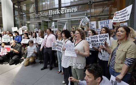 new york times staffers stage walkout to protest job cuts wsj