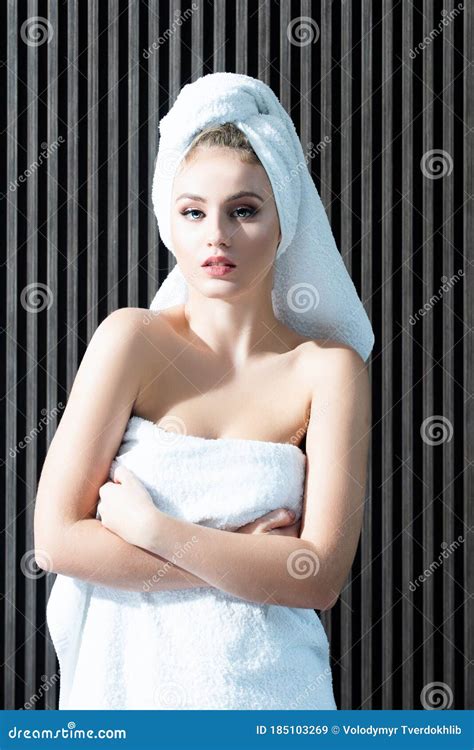 Young Woman In Towel On Head After Shower Cute Girl With Naked Shoulders Wearing White Towel