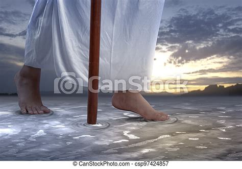 Jesus Christ Walking With Stick On The Water With Dramatic Background
