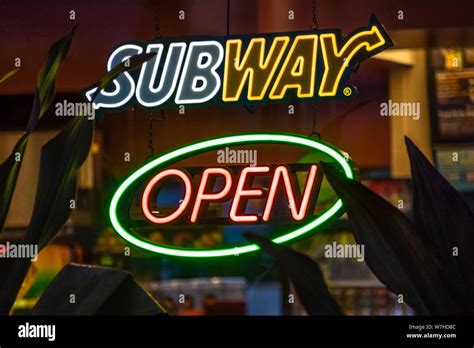 Neon Open Sign In The Window Of A Subway Fast Food Sandwich Shop
