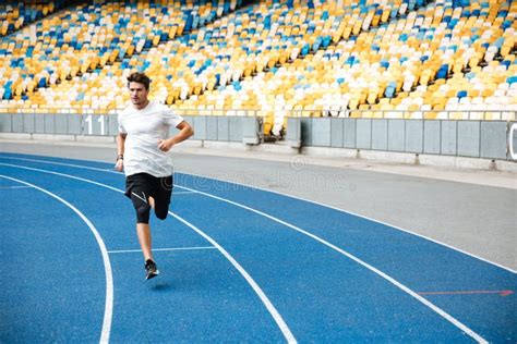 Young Sprinter Running On Athletics Track Stock Photo Image Of Motion