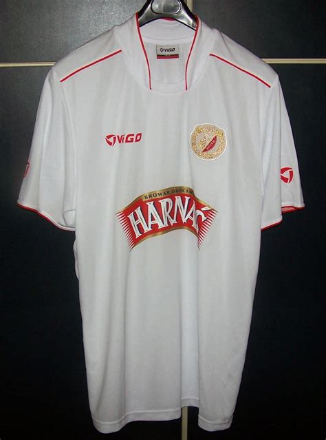 All scores of the played games, home and away stats, standings table. Widzew Lodz Away football shirt 2009 - 2010.