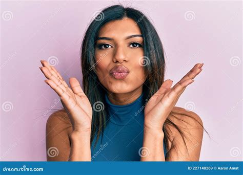 Young Latin Transsexual Transgender Woman With Hands Over Face Looking