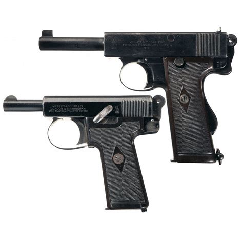 Two Webley And Scott Semi Automatic Pistols