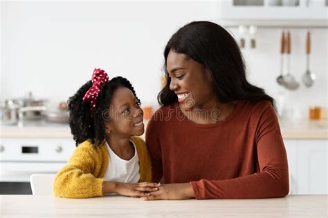 Portrait Of Loving African American Mom And Little Daughter Bonding At