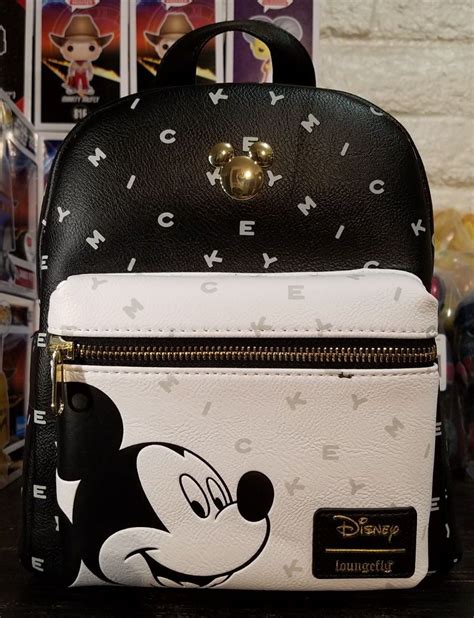 The lining on this one is super cute with the bright red with mickey and minnie mouse outlines. Loungefly Disney Mickey Mouse mini backpack | Mickey mouse ...