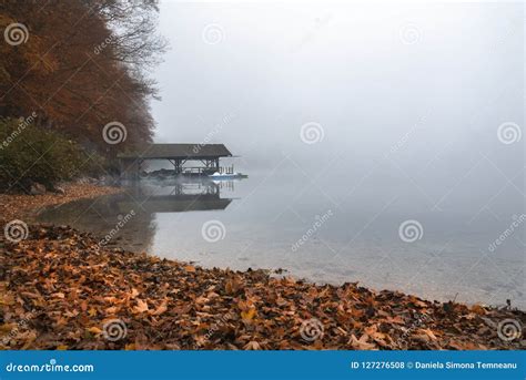 Dock On Lake In Autumn Fog Stock Photo Image Of Boats 127276508