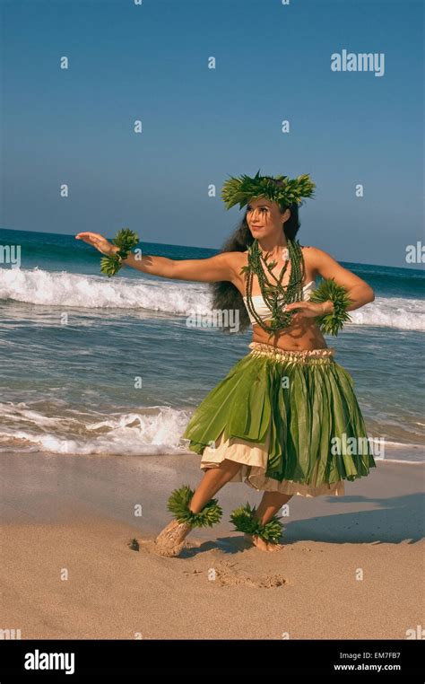 Hula Dancer In Ti Leaf Skirt Haku Lei In A Dancing Pose On The Beach