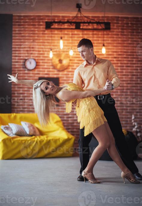 Young Couple Dancing Latin Music Bachata Merengue Salsa Two Elegance Pose On Cafe With Brick