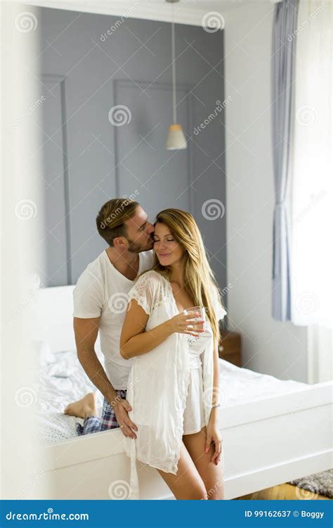 Loving Couple Kissing On Bed In The Room Stock Image Image Of Kissing