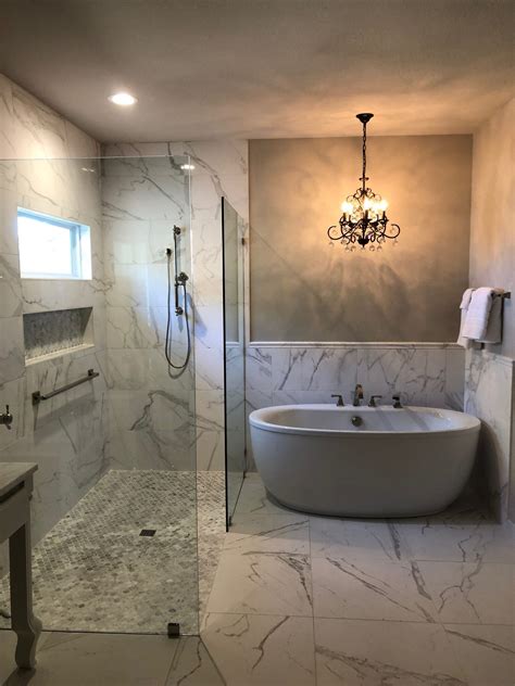 Upgrade the standard marble wall with the marble hex tiles. Marble master bathroom with curbless shower, freestanding ...
