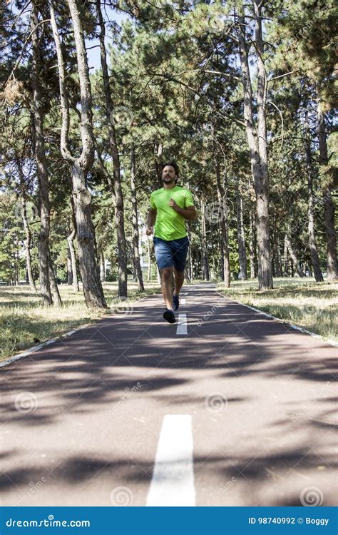 Young Man Running In The Park Stock Photo Image Of People Practicing